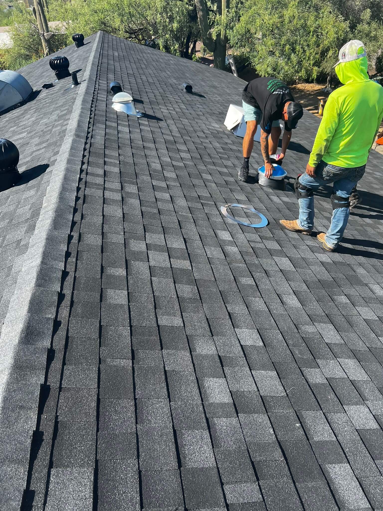 Professional team performing roof repair in Phoenix