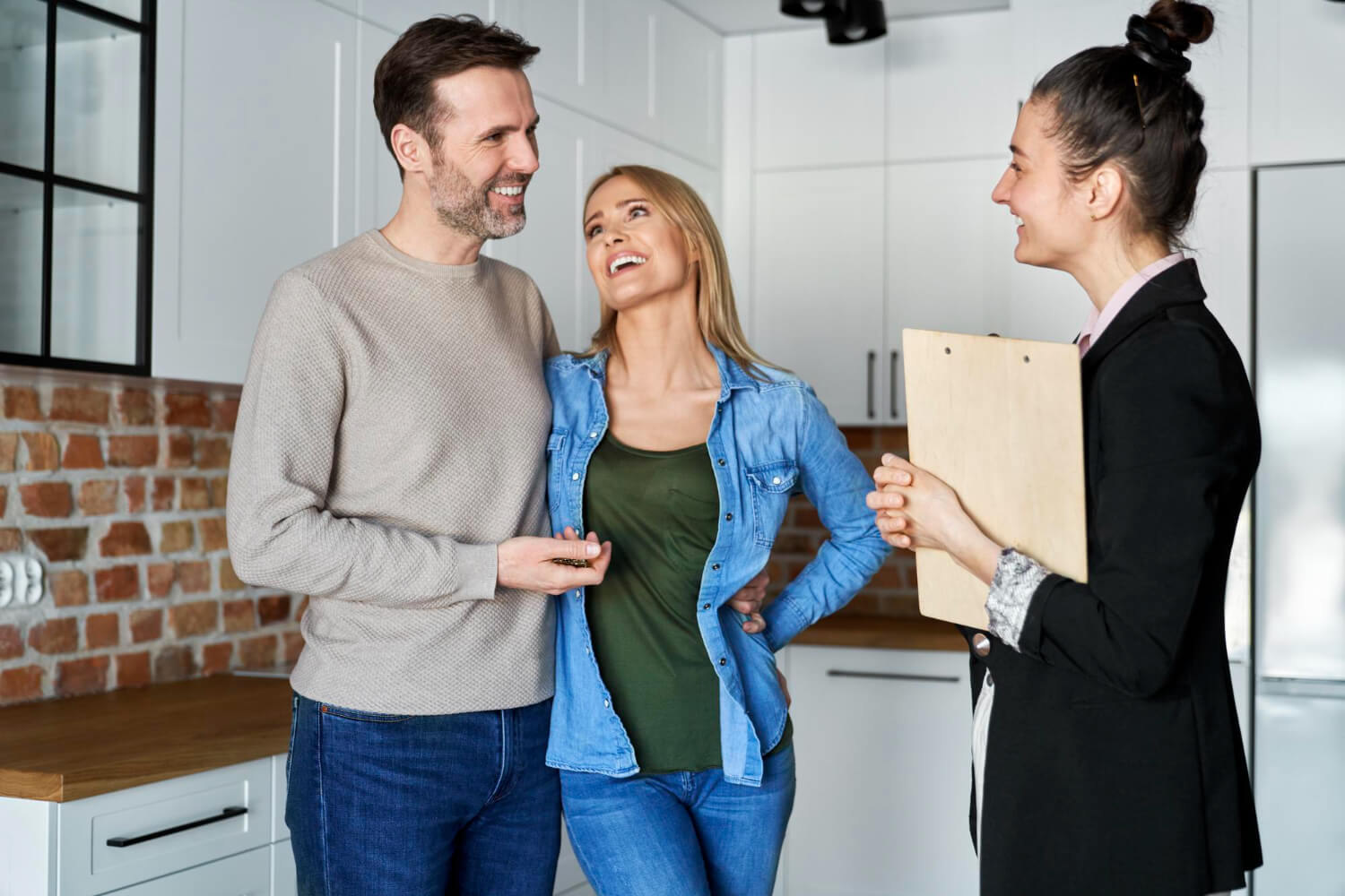 Happy homeowners celebrating high property appraisal after roof renovation